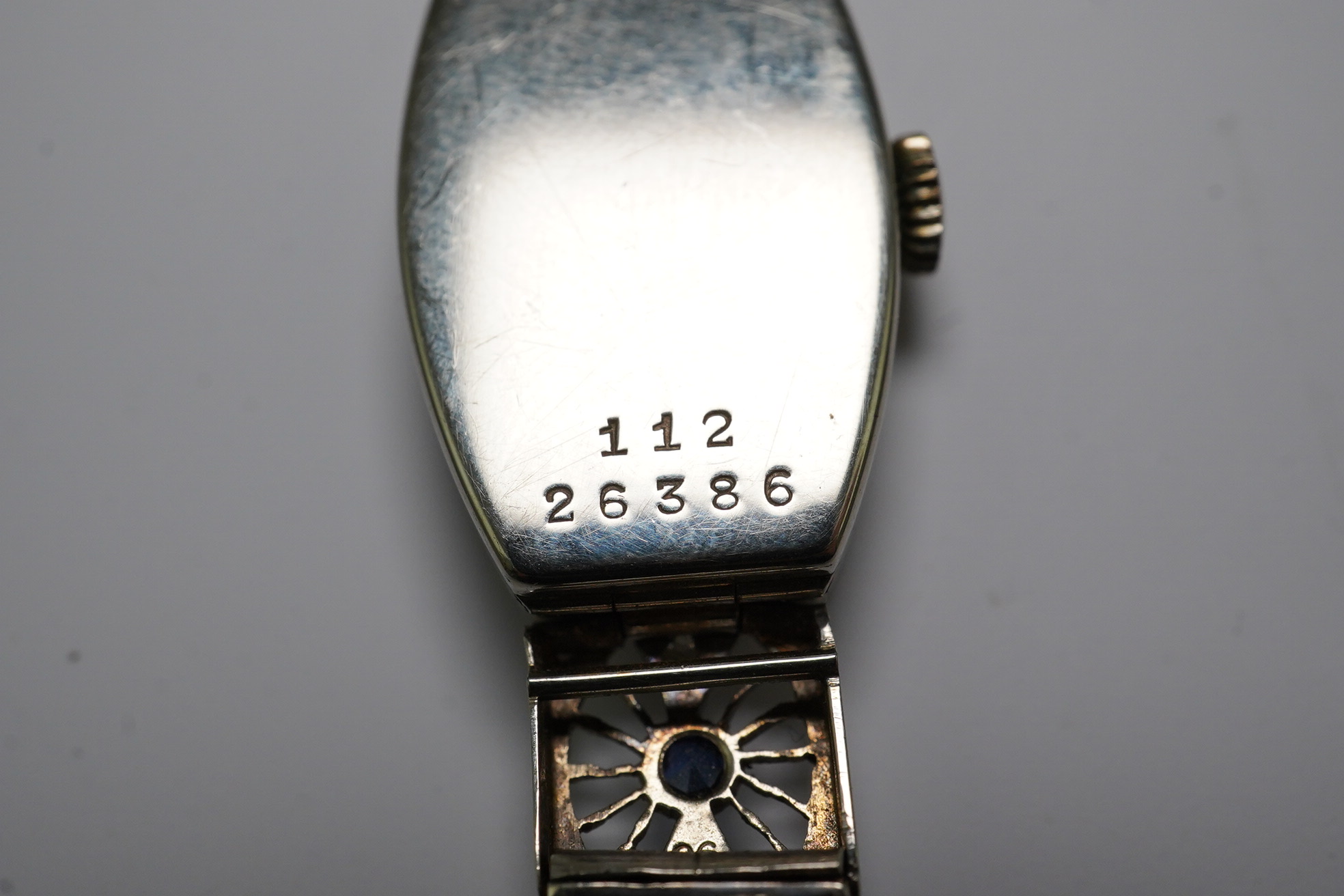 A lady's 1930's Art Deco pierced 18ct gold, sapphire and diamond set Rolex manual wind cocktail watch, on an 18ct gold and platinum expanding bracelet